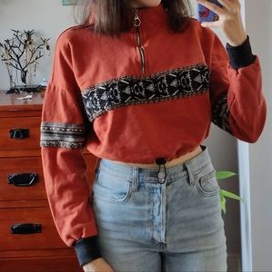 Crop orange quarter zip sweater with drawstring and cute tribal pattern
